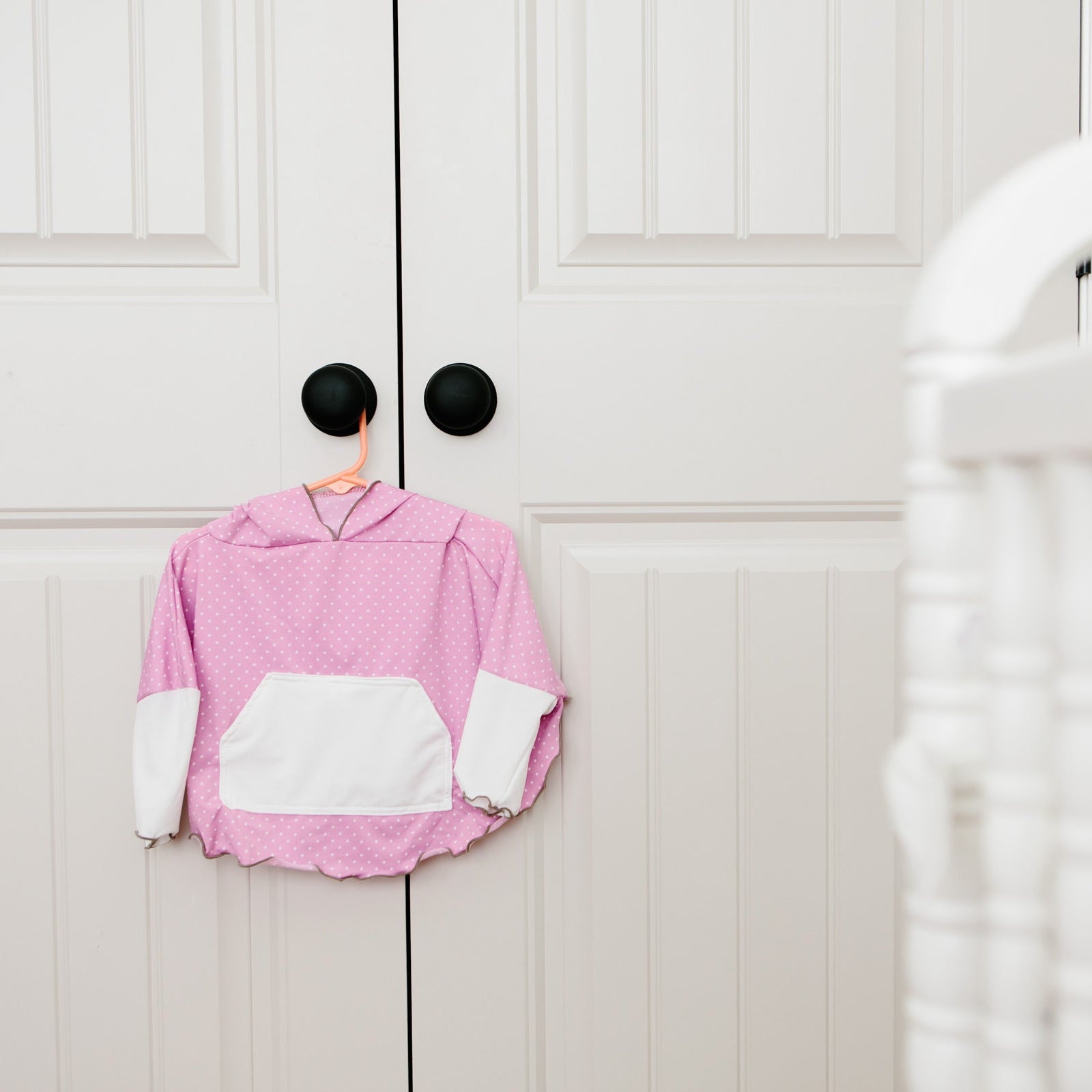 pink polka eclipse children's poncho in nursery