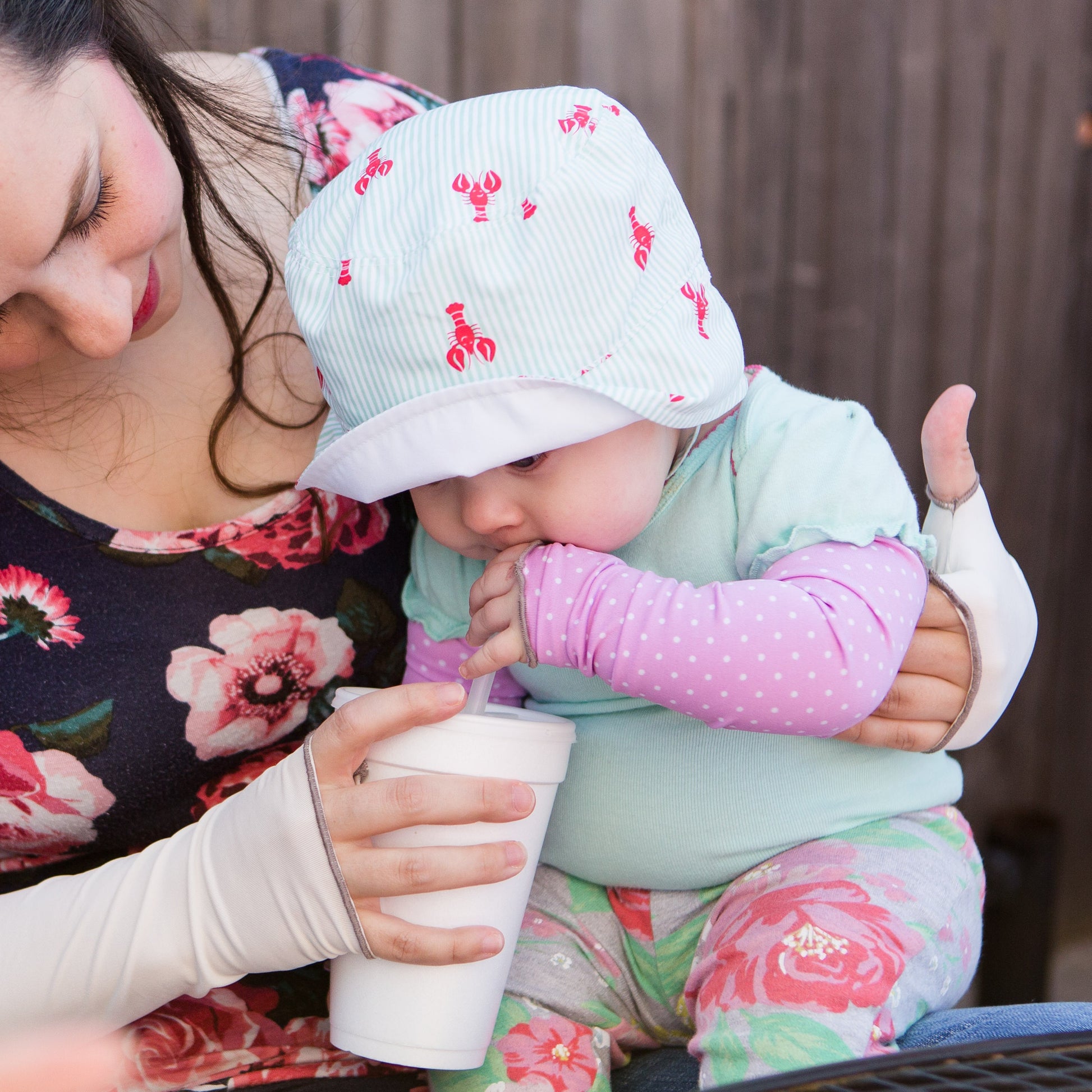 eclipse children's sun sleeves in pink on infant