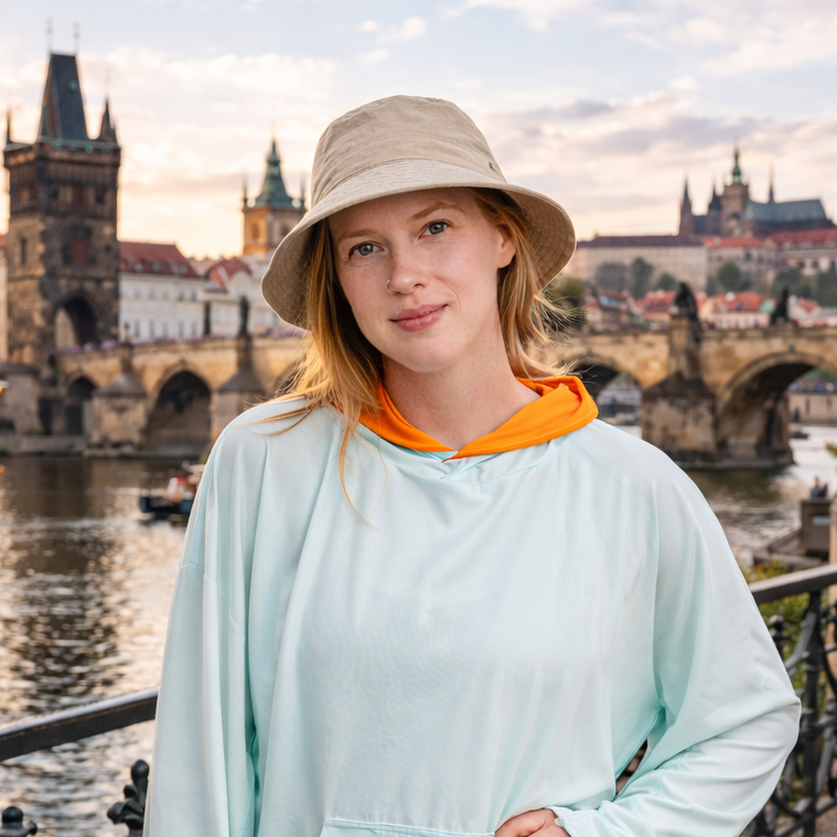woman wearing eclipse equinox hoodie cover up in aqua in prague