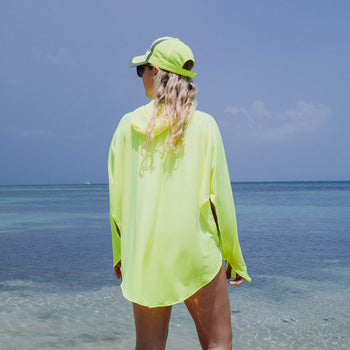 Woman wearing the UPF50 eclipse Equinox Hoodie cover-up